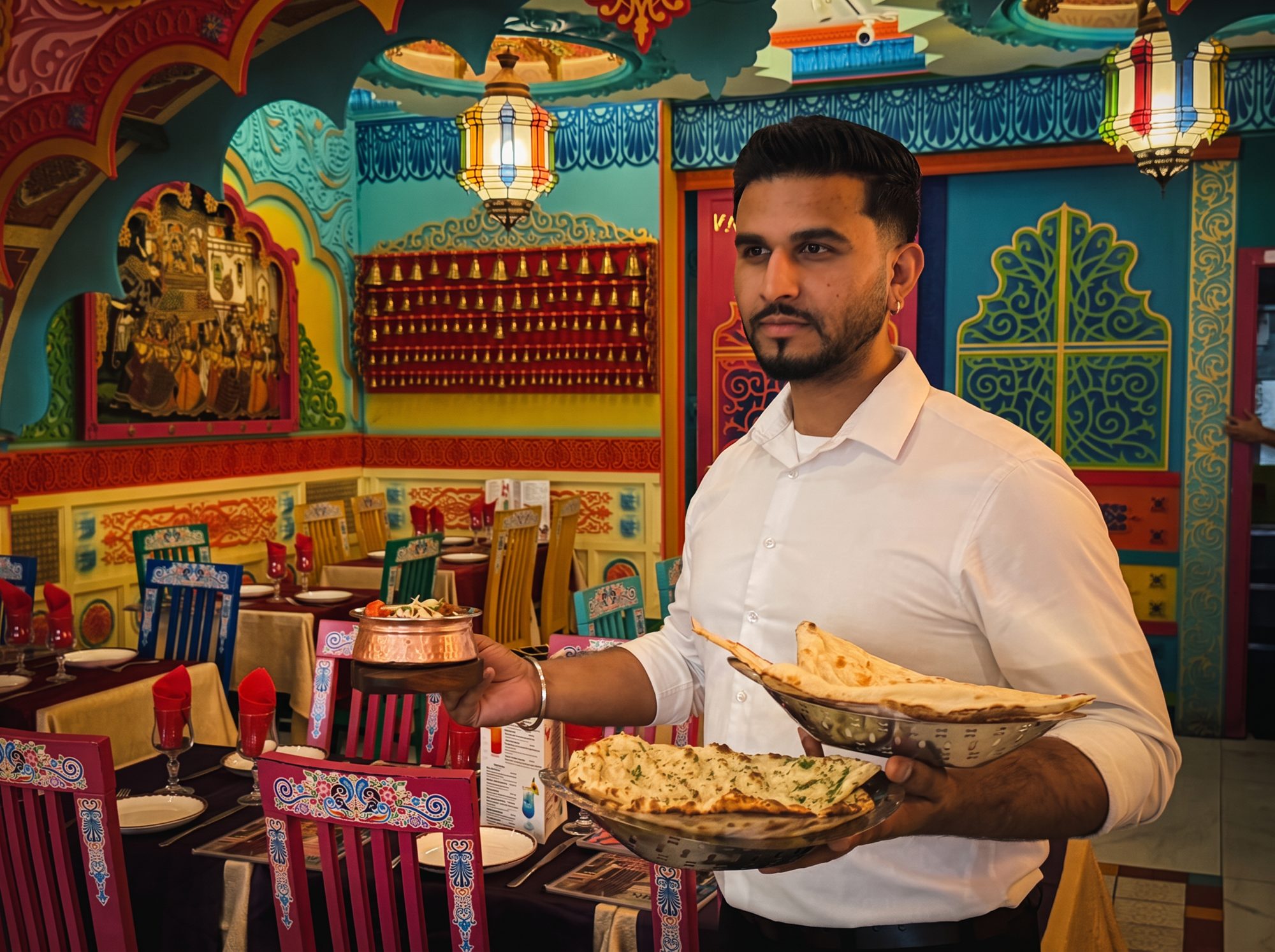 A Swaagat host presenting freshly baked naan